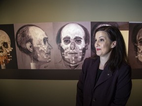 Karen Ryan, curator of Death in the Ice - The Mystery of the Franklin Expedition, stands in front of forensic artist drawings skulls recovered in the hopes of identifying the sailors as the public is invited to the Canadian Museum of History to explore the enduring mystery behind Sir John Franklin's tragic expedition.