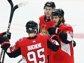 Senators winger Mike Hoffman, right, celebrates his goal with Matt Duchene and Ryan Dzingel during the first period of a Feb. 6 game against the Devils.