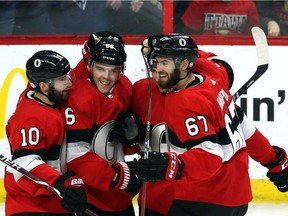 Ben Harpur (67) celebrates a Senators goal with, left to right, Tom Pyatt, Magnus Paajarvi and Cody Ceci during a Feb. 17 game against the Rangers.