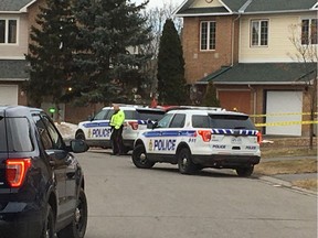 Police at scene of city's 10th homicide of 2018 on Covington Place in Centrepointe Thursday.