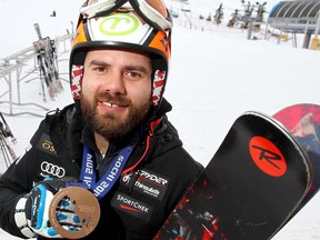 2014 Olympic Winter Games bronze medallist Jan Hudec shows off his prize at Canada Olympic Park in Calgary, Alta. on Tuesday November 25 2014.