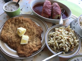 clockwise from bottom left, large schnitzel, jaeger sauce, two cabbage rolls, and spaeztle at Duna Bistro, pic by Peter Hum