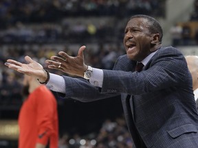 Toronto Raptors coach Dwane Casey argues a call during the first half of the team's NBA basketball game against the Indiana Pacers, Thursday, March 15, 2018, in Indianapolis.