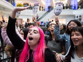 Morgan Pettifer, front left, 19, and others cheer for Virginia to Vegas (Derik John Baker) while waiting to take a photograph with him during Juno Fan Fare in Burnaby, B.C., on Saturday, March 24, 2018. The Juno Awards will be held Sunday in Vancouver.