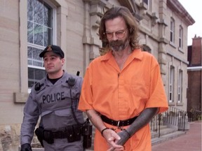 Leroy Baumhour is led out of Pembroke court following a brief appearance in November 1999.