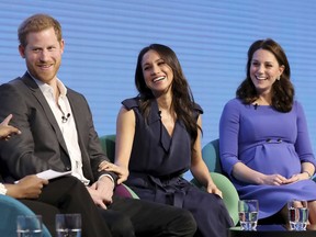 From left, Britain's Prince Harry, Meghan Markle, and Kate, Duchess of Cambridge during the first annual Royal Foundation Forum in London, Wednesday Feb. 28, 2018. Under the theme 'Making a Difference Together', the event will showcase the programmes run or initiated by The Royal Foundation.