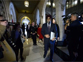 Minister of National Defence Minister Harjit Sajjan, Minister of Foreign Affairs Chrystia Freeland and Chief of Defence Staff Jonathan Vance leave after holding a press conference on Canada's peacekeeping mission to Mali in the foyer of the House of Commons on Parliament Hill in Ottawa Monday, March 19, 2018.