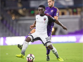 Adonijah Reid (30) of Fury FC protects the ball against an Orlando City defender in a United Soccer League game on Aug. 16, 2017. Mark Thor/Orlando City B