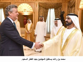 Francis Matthew, 60, a former newspaper editor, was employed by the English-language Gulf News, pictured with Sheikh Mohammad Bin Rashid Al-Maktoum, ruler of Dubai