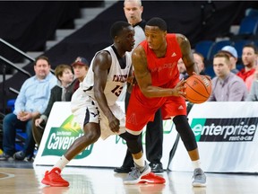 Carleton's Munis Tutu (13) guards Acadia Axemen's Trevon Grant (7) during Thursday's first-round game in Halifax. U Sports photo.