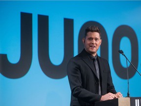 Michael Buble pauses while speaking after being introduced as the host of the 2018 Juno Awards, which will be held in Vancouver, during an announcement in Vancouver, B.C., on Tuesday November 21, 2017.