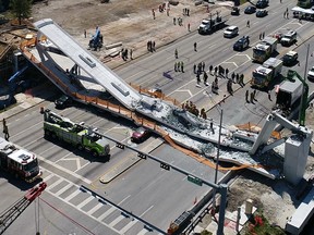 This photo provided by DroneBase shows the collapsed pedestrian bridge at Florida International University in the Miami area on Thursday, March 15, 2018.