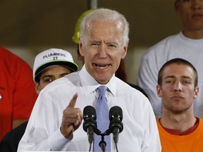 FILE - In this March 6, 2018 file photo, former Vice President Joe Biden speaks at a rally in support of Conor Lamb, the Democratic candidate for the March 13 special election in Pennsylvania's 18th Congressional District in Collier, Pa. Biden says he would "beat the hell" out of President Donald Trump in high school if Trump disrespected women. He spoke Tuesday at an anti-sexual assault rally at the University of Miami.