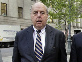 FILE - In this April 29, 2011, file photo, attorney John Dowd walks in New York. One of President Donald Trump's attorneys floated the possibility of pardoning two of the president's former advisers caught up in the Russia probe in discussions with their lawyers last year, The New York Times reported Wednesday, March 28, 2018. The newspaper, citing three anonymous people with knowledge of the discussions, says that then-Trump attorney, John Dowd, raised the idea with attorneys for former Trump campaign chairman Paul Manafort and former national security adviser Michael Flynn.