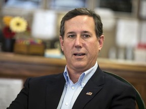 FILE - In this Jan. 19, 2016, file photo, former Pennsylvania Sen. Rick Santorum meets with voters in Greenfield, Iowa. On Sunday, March 25, 2018, Santorum said students who are rallying for gun control should instead learn CPR to help protect their classmates during a school shooting.