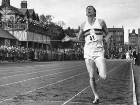 FILE - In this May 6, 1954, file photo, British athlete Roger Bannister breaks the tape to become the first man ever to break the four minute barrier in the mile at Iffly Field in Oxford, England. Bannister, the first runner to break the 4-minute barrier in the mile, has died. He was 88. Bannister's family said in a statement that he died peacefully on Saturday, March 3, 2018, in Oxford "surrounded by his family who were as loved by him, as he was loved by them." (AP Photo/File) ORG XMIT: NY352