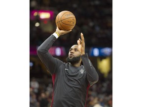 Cleveland Cavaliers' LeBron James (23) warms up before an NBA basketball game against the New Orleans Pelicans in Cleveland, Friday, March 30, 2018.