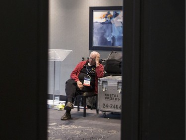 A member of the Ontario PC's technical staff waits in a room reserved for media availabilities as confusion continues over the Ontario PC leadership announcement in Markham, Ont., on Saturday, March 10, 2018.