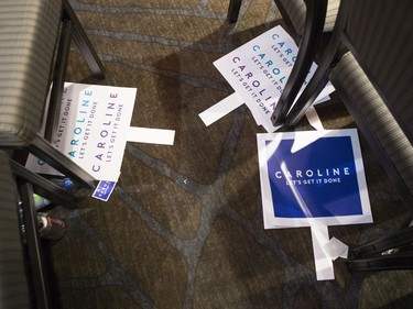 Caroline Mulroney placards are left on the floor after supporters left the convention hall following an announcement that the hall was no longer available to them.