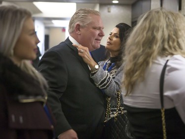 Karla Ford speaks with her husband, candidate Doug Ford, as they make their way to a holding room during the Ontario Progressive Conservative leadership announcement in Markham, Ont. on Saturday, March 10, 2018.