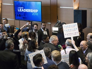 Candidate Doug Ford makes his way past journalists and attendees to listen to introductory speeches at the Ontario Progressive leadership announcement in Markham, Ont. on Saturday, March 10, 2018.