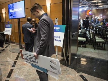 A Christine Elliott supporter leaves the convention hall after Hartley Lefton, chair of the leadership election organising committee, announced the delay of the Ontario PC leadership announcement.