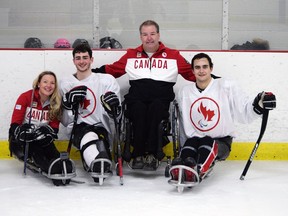 After Todd Nicholson, second from right, was named as Canada's chef de mission for the 2018 Paralympic Games, he joined wife Emily Glossop and Ottawa-area para ice hockey players Ben Delaney, second from left, and Tyrone Henry on the ice for a photo.