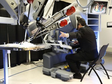 Thierry Mesana shows the media Da Vinci, a new robot designed to facilitate minimally invasive surgical procedures.