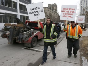 Several dozen tow truck drivers arrive at Ottawa City Hall to hold a protest Monday March 5, 2018. Tow truck operators rallied at the Ottawa Police Service's Orléans station Monday morning to make a protest against what they claim is a police-backed monopoly.