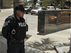 A police officer stands outside the Trump Ocean Club International Hotel and Tower in Panama City.