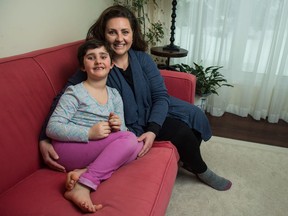 Jacqueline Patron, right, and her daughter Elyse Patron, pose for a portrait in their home in Regina on March 23, 2018.