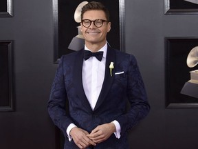 In this Jan. 28, 2018, file photo, Ryan Seacrest arrives at the 60th annual Grammy Awards at Madison Square Garden in New York.