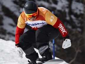 Alex Massie of Canada competes during the men's snowboard cross run.