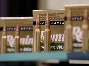 FILE - In this Tuesday, Jan. 15, 2013 file photo, Remington rifle cartridges are displayed at the 35th annual SHOT Show in Las Vegas. U.S. gun maker Remington Outdoor Company has filed for bankruptcy protection after months of financial problems, falling sales and lawsuits tied to the Sandy Hook Elementary School massacre. Records from the bankruptcy court of the district of Delaware show that the company filed late Sunday, March 25, 2018.