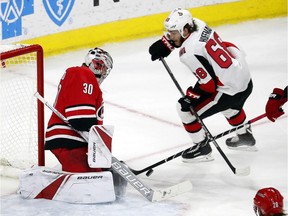 Senators winger Mike Hoffman (68) has this shot turned away by Hurricanes goaltender Cam Ward (30) during the third period of a game on Jan. 30 in Raleigh, N.C.