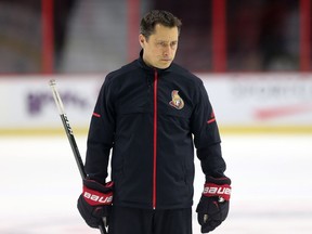 Head coach Guy Boucher watches the players during Senators practice at Canadian Tire Centre on Friday.