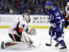 Ottawa Senators goaltender Mike Condon (1) makes a save on Tampa Bay Lightning centre J.T. Miller (10) Tuesday, March 13, 2018, in Tampa, Fla.