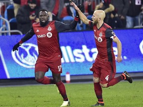 Toronto FC forward Jozy Altidore (17) celebrates his goal with teammate Michael Bradley (4) during the second half in CONCACAF Champions League quarter-final action against the UANL Tigres, in Toronto on Wednesday, March 7, 2018.