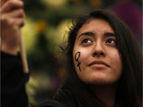 A woman waves a flag during a protest marking the International Women's Day in Madrid.