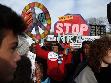 Crowds of people hold signs on Pennsylvania Avenue at the "March for Our Lives" rally in support of gun control, Saturday, March 24, 2018, in Washington.