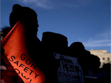 A student from Marjory Stoneman Douglas High School holds a sign during the "March for Our Lives" rally in support of gun control in Washington, Saturday, March 24, 2018.