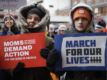 Demonstrators gather during the March for Our Lives protest for gun legislation and school safety outside city hall, Saturday, March 24, 2018, in Cincinnati. Students and activists in several dozen Ohio communities planned events Saturday in conjunction with a Washington march spearheaded by teens from Marjory Stoneman Douglas High School in Parkland, Fla., where over a dozen people were killed in February.