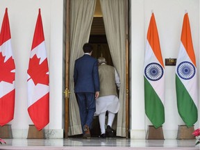 Prime Minister Justin Trudeau meets with Prime Minister of India Narendra Modi at Hyderabad House in New Delhi, India on Friday, Feb. 23, 2018. Conservatives are forcing MPs to stay up all night voting continuously on more than 250 motions, a filibuster launched in retaliation for the Liberals voting down a Tory motion to call Justin Trudeau's national security adviser to testify at a House of Commons committee about the prime minister's disastrous trip to India.