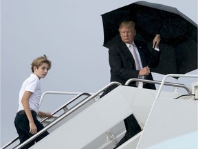 President Donald Trump and his son Barron board Air Force One.