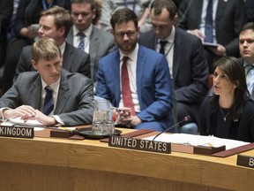 British Deputy Ambassador to the United Nations Jonathan Allen, right, listens as American Ambassador to the United Nations Nikki Haley speaks during a Security Council meeting on the situation between Britain and Russia, Wednesday, March 14, 2018 at United Nations headquarters. Britain said Wednesday it would expel 23 Russian diplomats and sever high-level bilateral contacts after Russia ignored a deadline to explain how a Soviet-developed nerve agent was used against ex-spy Sergei Skripal and his daughter Yulia.