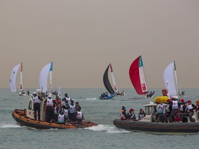 In this photo taken on Friday, March 23, 2018, Orange sky is seen during a sailing regatta in the Black Sea near Sochi, Russia . Dust from a sandstorm in the Sahara desert is causing snow and skies in eastern Europe to turn orange, transforming regions of in Eastern Europe.