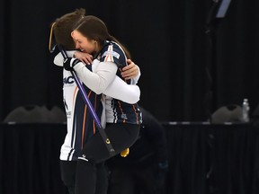 Team Laura Crocker and Kirk Muyres celebrate after defeating Team Kadriana Sahaidak and Colton Lott 8-7 in the gold-medal final of the 2018 Canadian Mixed Doubles Curling Championship at the Leduc Recreation Centre, April 1, 2018.
