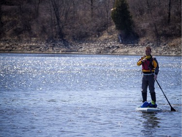 Warmer temperatures hit Ottawa Sunday April 22, 2018 and people were out and about enjoying the sunshine at Mooney's Bay Park. Kevin Payan was all smiles as he kicked off the paddling season on his standup paddle board Sunday afternoon.