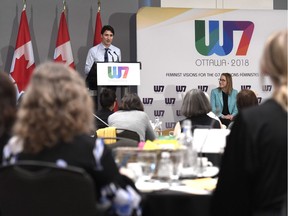 Oxfam Canada executive director Julie Delahanty and delegates looks on as Prime Minister Justin Trudeau delivers remarks at the W7: Feminist Visions for the G7 meeting in Ottawa on Wednesday. Will the G7 let women's voices be heard?