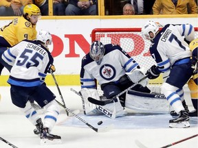 Connor Hellebuyck made 47 saves to lead the Winnipeg Jets over the Nashville Predators on Friday night.